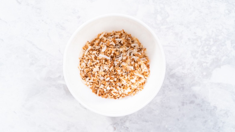 toasted coconut flakes in a bowl