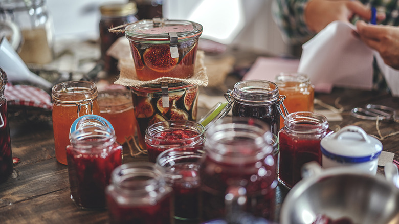 someone canning jars of jam 