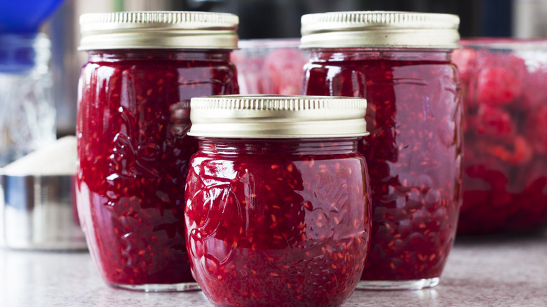 jars of homemade jam on a table