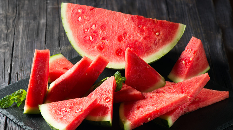 Watermelon slices on board