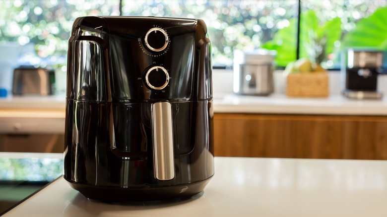 black air fryer on kitchen counter