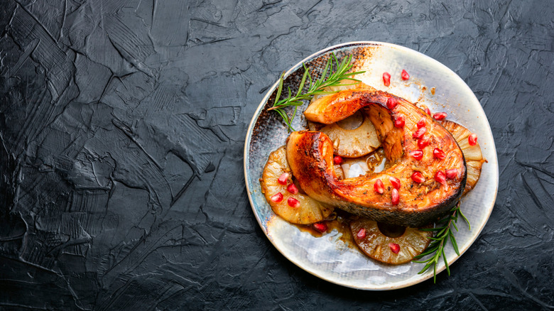 Grilled fish steak on pineapple