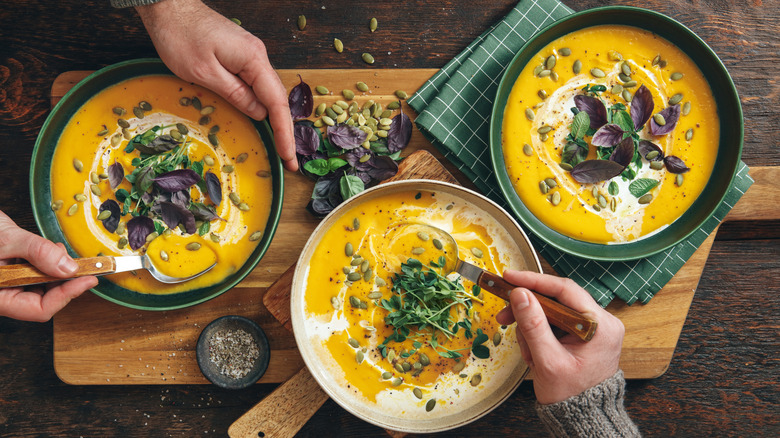 Serving pumpkin soup