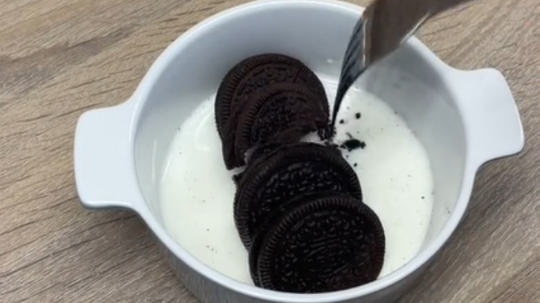 Oreos and milk in ramekin