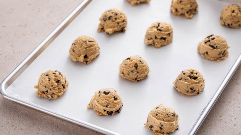 cookie dough balls on baking sheet