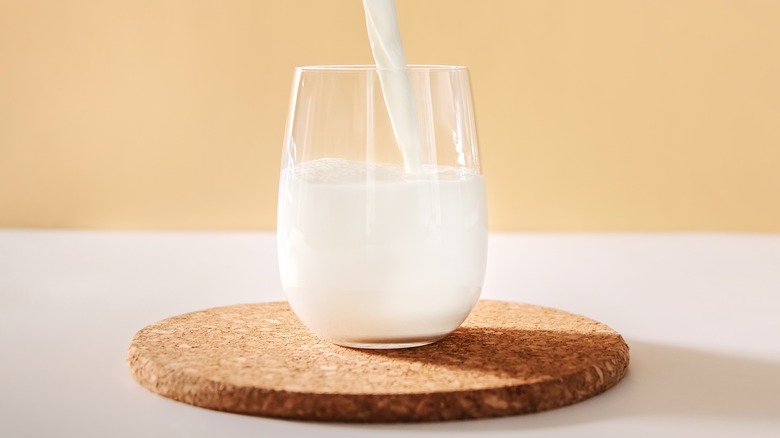 Milk pouring into glass