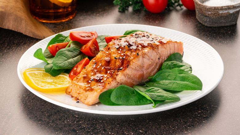 salmon dish with salad