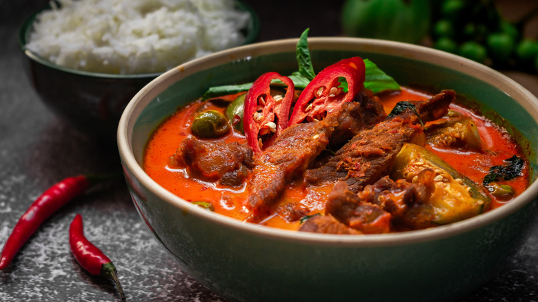 Bowl of food with chiles and rice