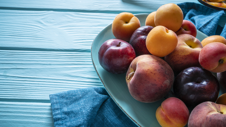 stone fruit on plate