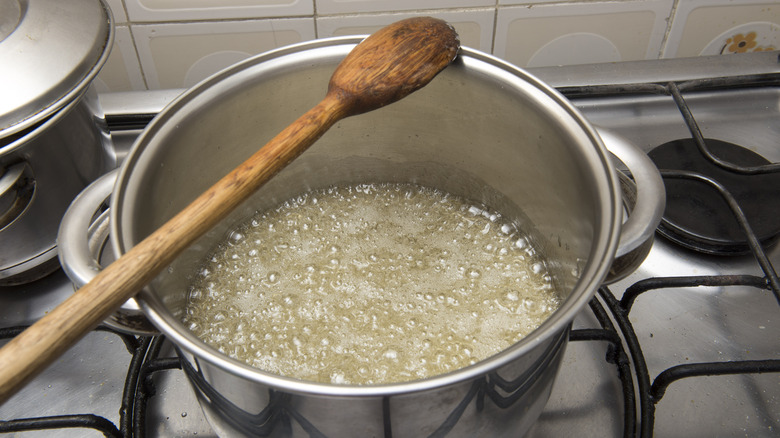 making candy sugar syrup in pot on stovetop