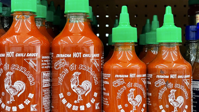 Bottles of sriracha hot sauce on display