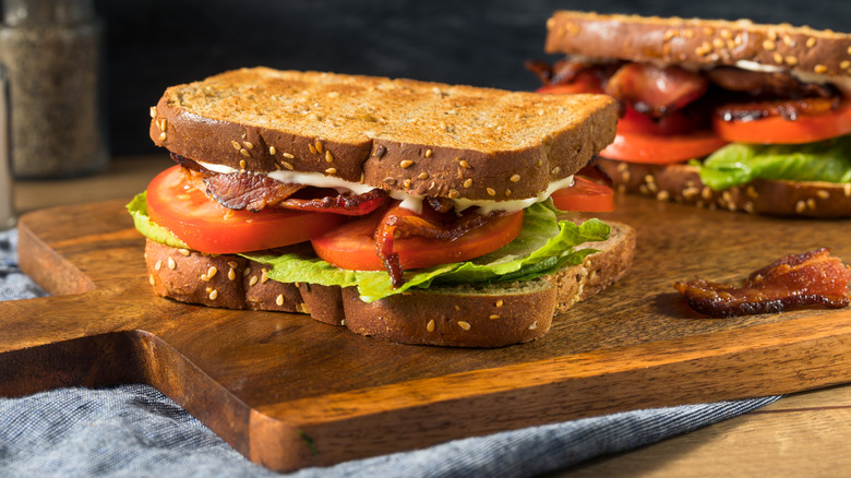 two BLTs on a board 