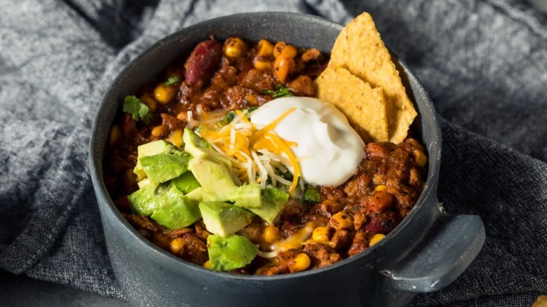 bowl of turkey chili with toppings