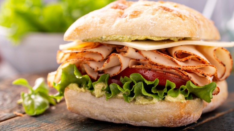 sliced turkey sandwich on ciabatta