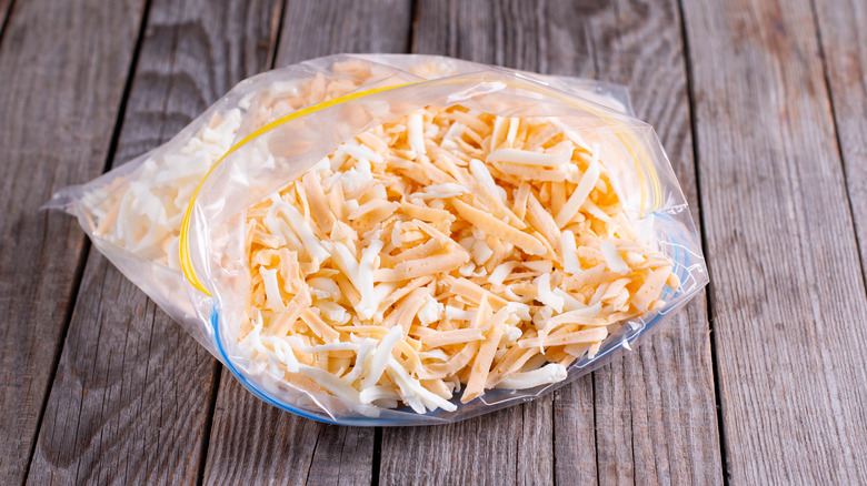 Frozen grated cheese in a plastic bag