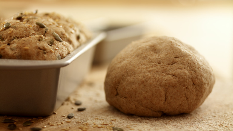 dough and bread in loaf pan