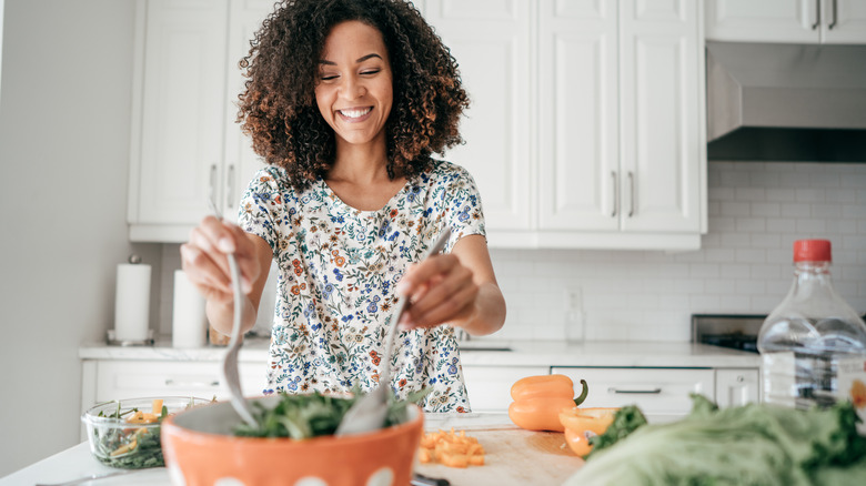 making a salad in the kitchen