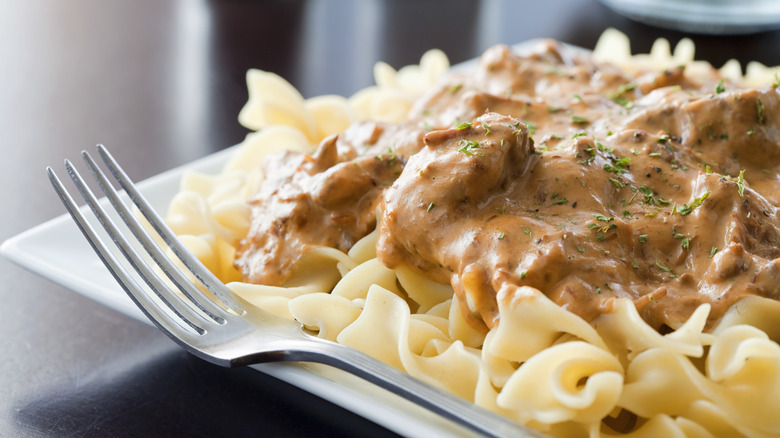 Beef stroganoff on egg noodles