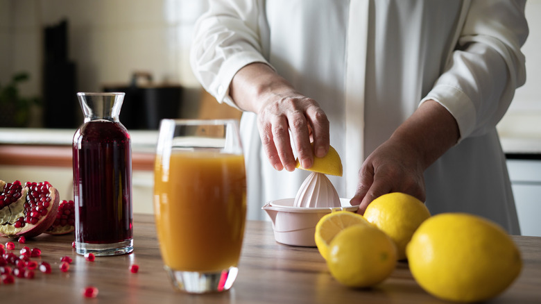 Person juicing lemons