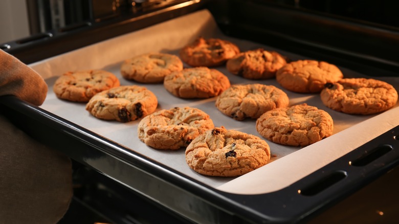 taking cookies out of oven