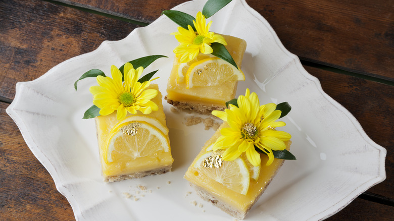 Lemon squares with floral garnish