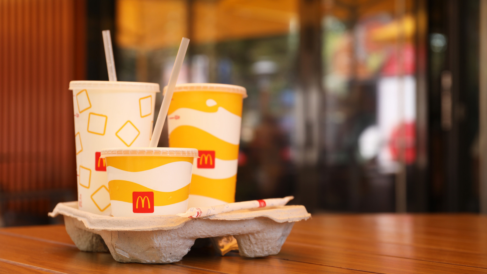 https://www.thedailymeal.com/img/gallery/your-mcdonalds-cup-lids-rectangular-buttons-actually-serve-a-purpose/l-intro-1701459164.jpg