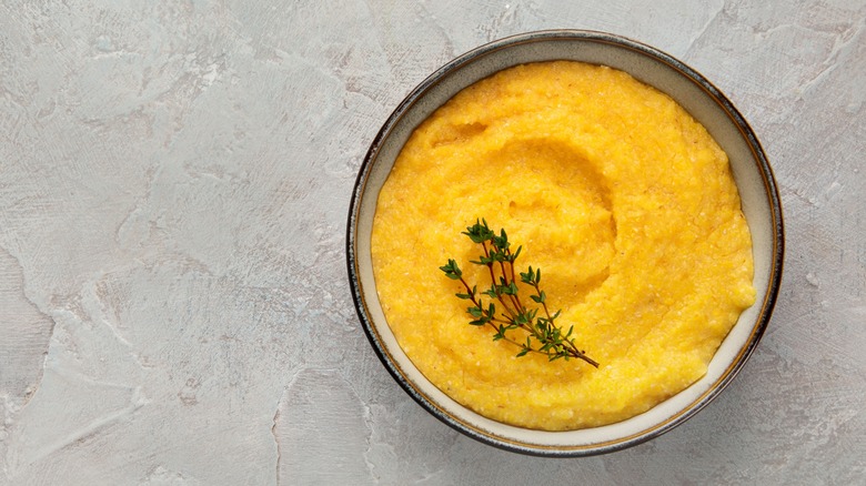 Simple polenta in a bowl with thyme