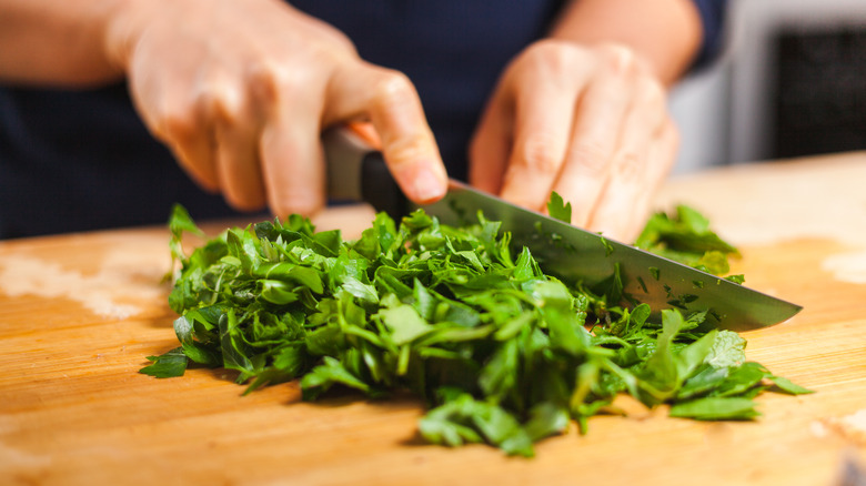 Person chopping mint