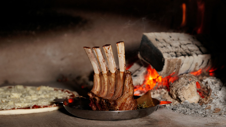 rack of lamb in brick pizza oven