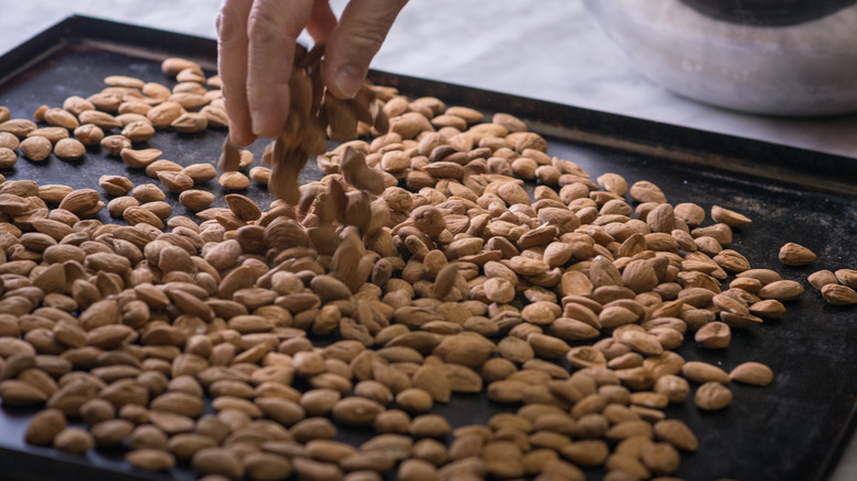 Man toasting almonds