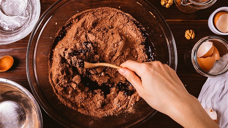 Wooden spoon in chocolate batter 