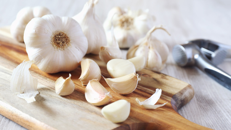 Garlic cloves on a cutting board