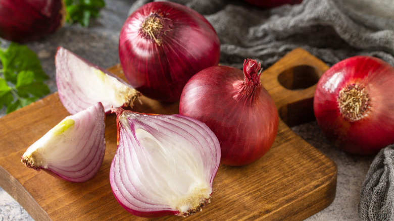 Red onions on cutting board